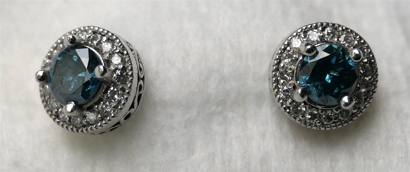 Pair of Outstanding 18kt White Gold Fancy Blue Diamond Stud Earrings with White Diamond Halos around Center Blue Diamonds -Center Diamonds Approx. 1/2 Carat Each -  Each Earring Measures 1/4"...