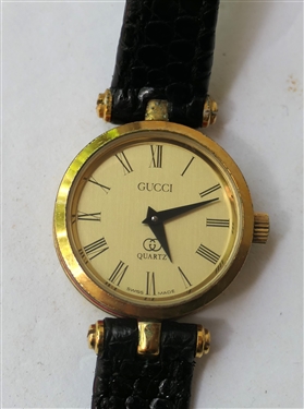 Gucci Quartz Wristwatch with Black Leather Band - Gold Dial with Red and Green Enamel Sides - Gucci Logo On Reverse