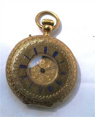 18kt Yellow Gold Pocket Watch - Le Comtn Geneve Movement - Case Engraved and Dated 1863 - Blue Enamel Roman Numerals  - Gold Dial - Fancy Engraved Case - Watch Measures 1 1/4" Across - Watch is...