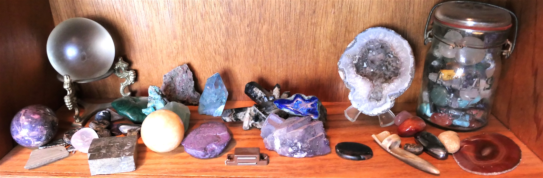 Lot of Stone and Geodes including stone Eggs, Crystal Ball on Stand, Jar of Stones, and Horn Carved Piece