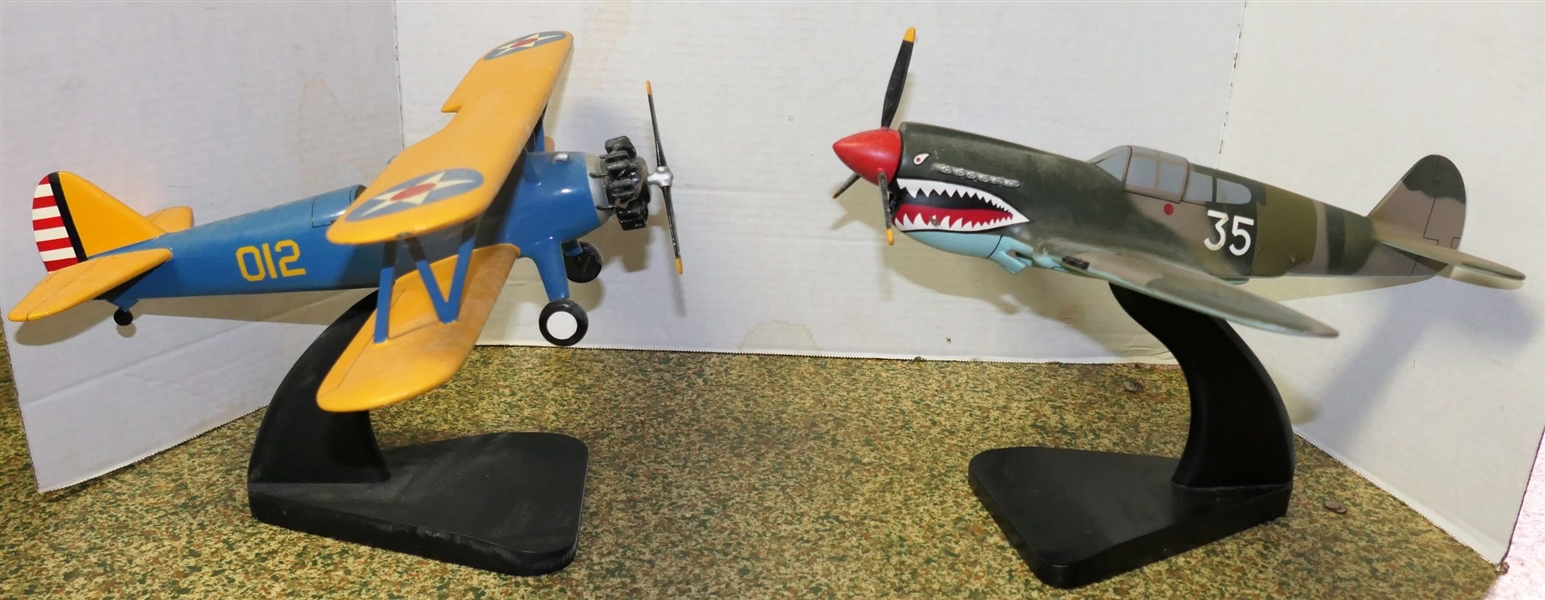 2 Military Airplane Models - Blue and Yellow 012 and Camo 35 - Both on Black Stands- Each Measures Approx. 9" Tall 