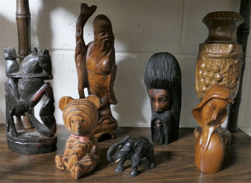 7 Wood Carvings including Bear, Woman, Elephant, Vase, Buddha, and Knight - Vase Measures 12"