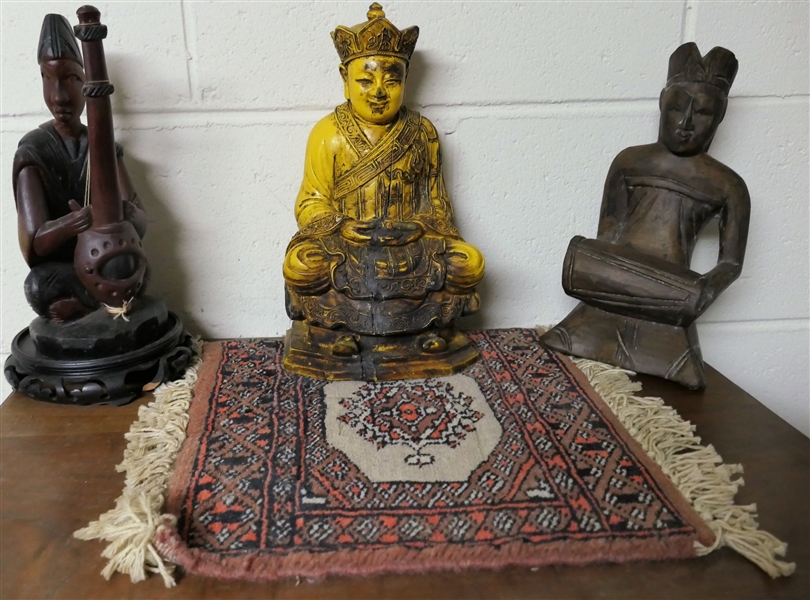3 Oriental Statues and Miniature Oriental Rug - 2 Wood Carved, and 1 Wood Carved and Polychrome Painted  - Yellow Buddha Measures 10 1/2"  