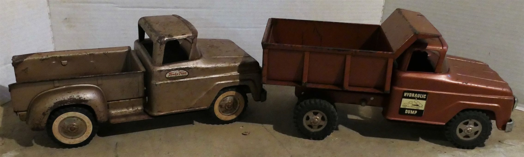 2 Metal Tonka Toys Trucks - Brown Hydraulic Dump Measures 6 1/2" tall 13 1/2" by 5 1/2" 