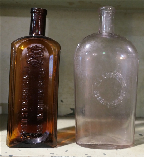 Amber Atlas Medicine Co - Henderson, NC Bottle and Clear D.C. Loughlin Henderson, NC Bottle - Clear Bottle Measures 9" tall
