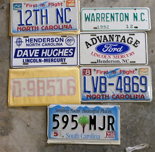 Lot of License Tags including Warrenton 1992, Advantage Ford - Henderson, NC, Dave Hughes Lincoln Mercury - Henderson, NC, South Carolina, and North Carolina