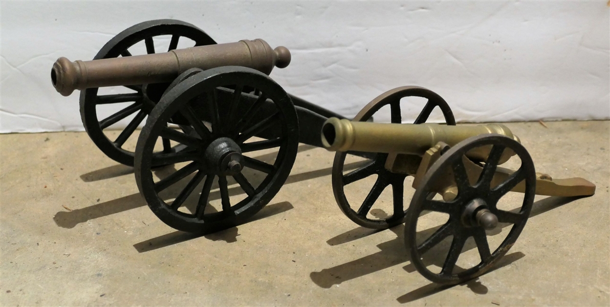 2 Brass and Iron Cannons - Smaller Measures 3" by 7 1/2" Larger Measures 3 1/2" tall 8" Long