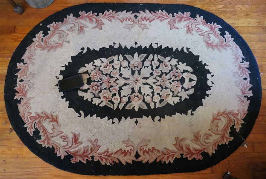 Black and Cream Oval Hook Rug - Needs Cleaning - Measures 66" by 45"