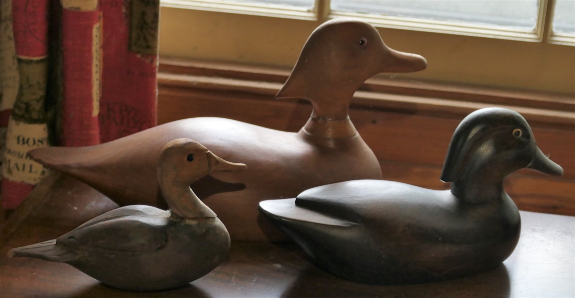 3 Wood Carved Ducks - 2 With Glass Eyes - Largest and Smallest Heads Have Been Repaired - Largest Duck Measures 6" tall 12" Beak to Tail 