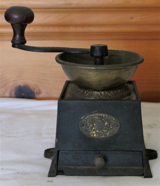 A. Kenrick & Sons Small Iron and Brass Coffee Grinder with Drawer - Measures 5" tall 4" by 4 1/2" - Small Chip to Lower Corner of Drawer 