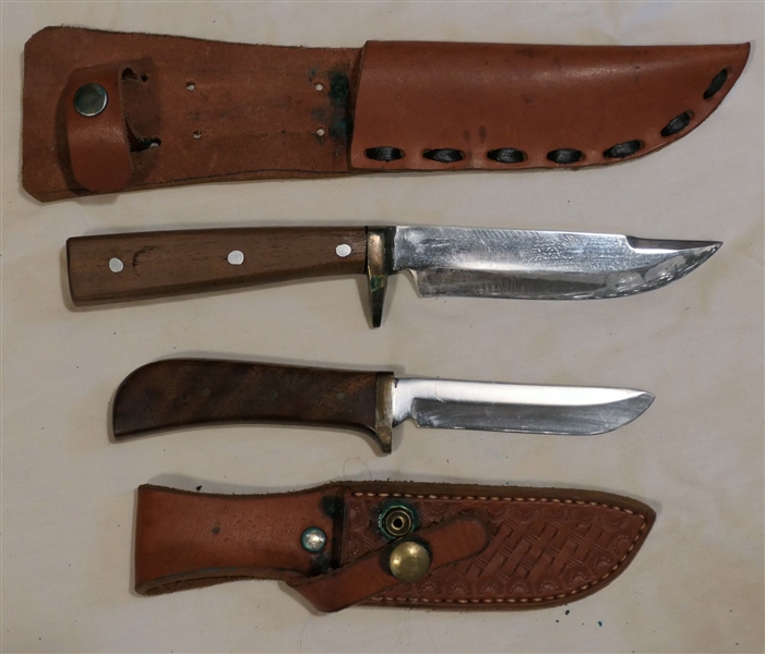 2 Wood Handled Hunting Knives in Leather Sheaths - Largest Measures 9 3/4" - Smaller Measures 8" Long