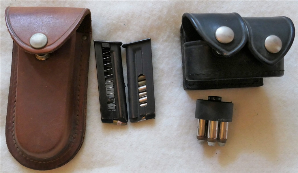 Leather Belt Pouch with 2 .22 Clips - Partially Full and Safariland 340-3 - Black Leather Revolver Quick Load Belt Pouch with 1 .38 Quick Load