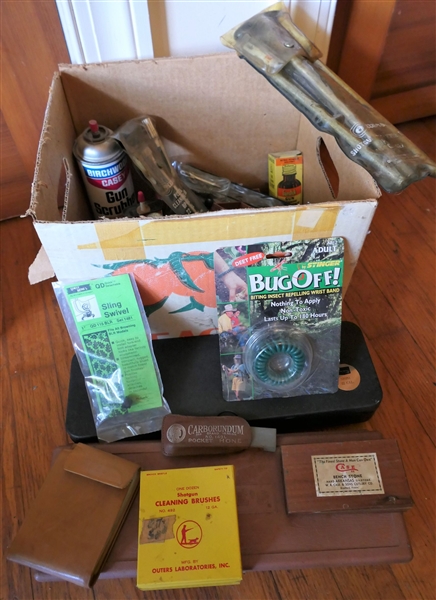 Lot of Gun / Hunting Supplies - Gun Oils, Cleaning Rods, Kits, Brushes, Case Sharpening Stone, Bug Off, Tin Litho Brush Box (Empty), Sling Swivel, Leather Wallet, Etc. 