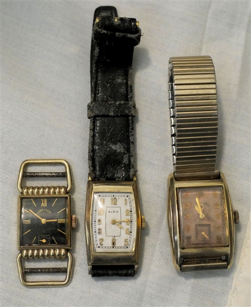 3 Elgin Wristwatches - Lord Elgin 10kt Gold Filled with Black Dial - Unusual Lugs, Elgin with Engraved Back, and 14kt Gold Filled Lord Elgin with Second Register and Stretch Band