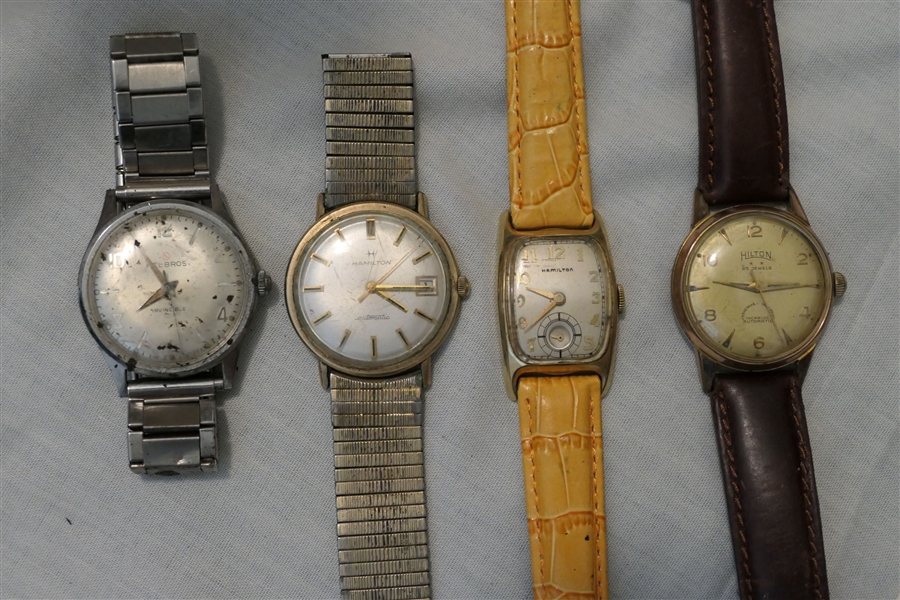 4 Mens Watches - Hamilton Gold Filled with Engraved Back - Orange Band, Hamilton Automatic with Date, Helbros Invincible, and Hilton 25 Jewels Automatic