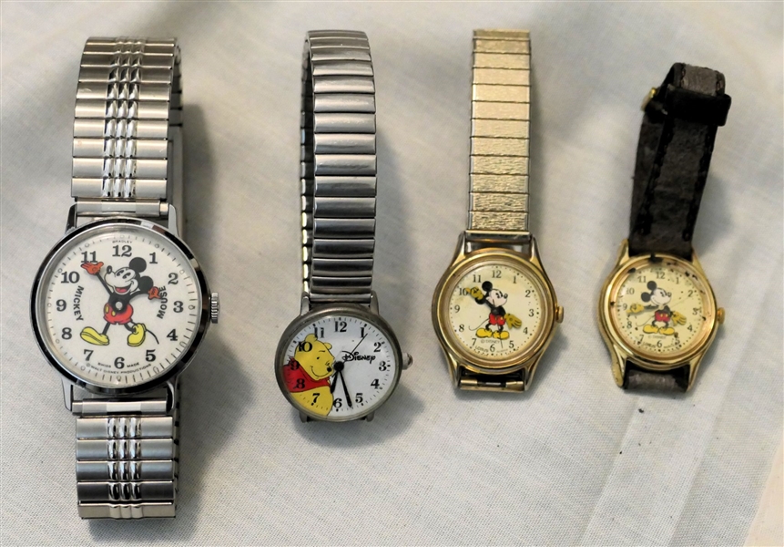 4 Disney Watches - Lorus Mickey Mouse, Winnie The Pooh, Swiss Made Mickey Mouse, and Lorus Mickey Mouse