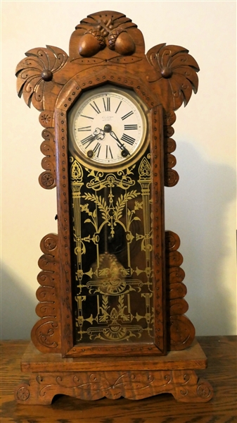L.E. Largen Clock Company Winston Salem, NC - Oak Clock - Nice Narrow Size - Carved Acorns At Top- With Key and Pendulum - Runs - Measures 21 1/2" Tall 11" by 4 1/4"