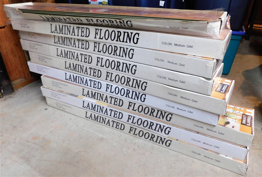 9 Boxes of Todays Living Oak  Laminated Flooring - Only 1 is Open 