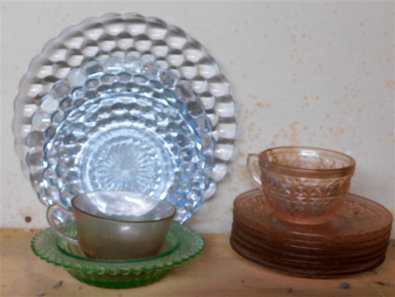 12 Pieces of Pink, Blue, and Green Depression Glass including Cup, Saucer, Plates, Butter Dish Base, Etc. 