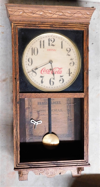 "Drink Coca Cola" Seth Thomas Thirty Hour Brass Clock- with Key and Pendulum - Oak Case - Missing Glass Inside Front Door - 36" 16" by 5"