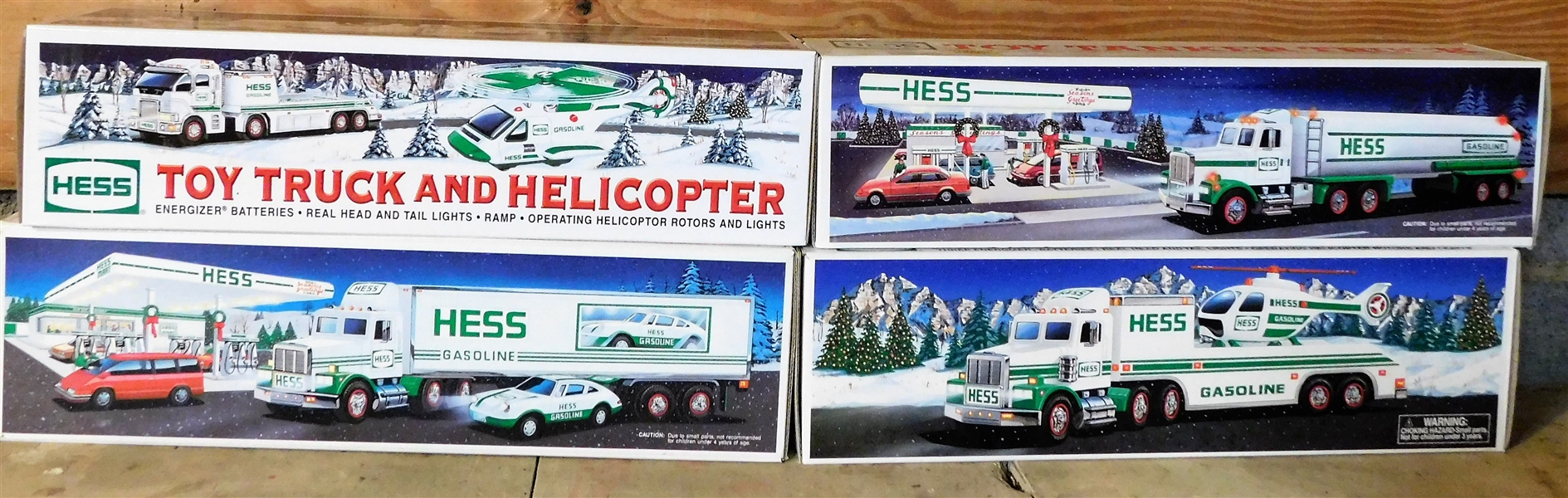 4 Hess Trucks including 1995 Toy Truck and Helicopter, 2006 Toy Truck and Helicopter, 1990 Toy Tanker Truck, and 1992 18 Wheeler and Racer