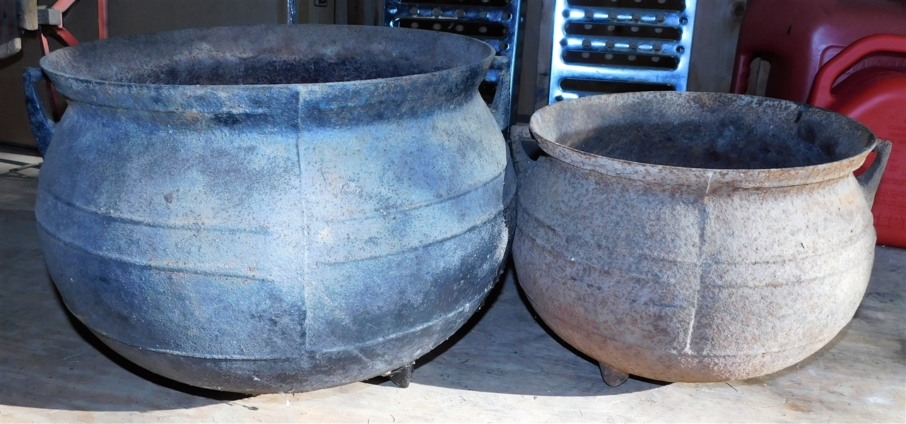 2 Cast Iron Pots - Smaller One Has Worn Down Foot - Larger one is 12" tall 14" Across