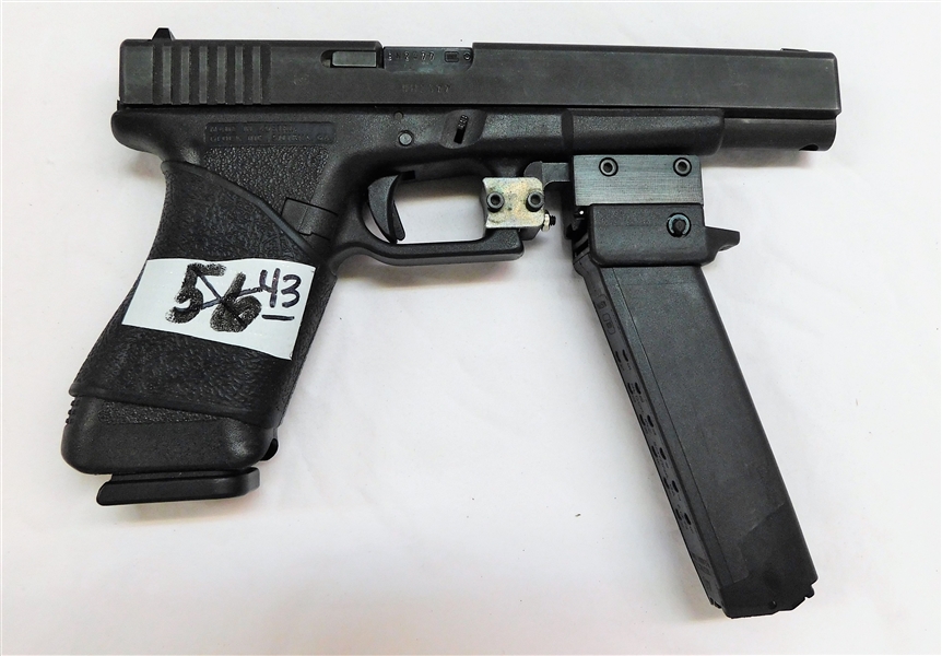 Glock Model 24 Semi-automatic Handgun - .40 SW Cal - Made in Austria - Extended Barrel - With Extra 14 Round Magazine that has an accessory Cap End Which Clips to Gun