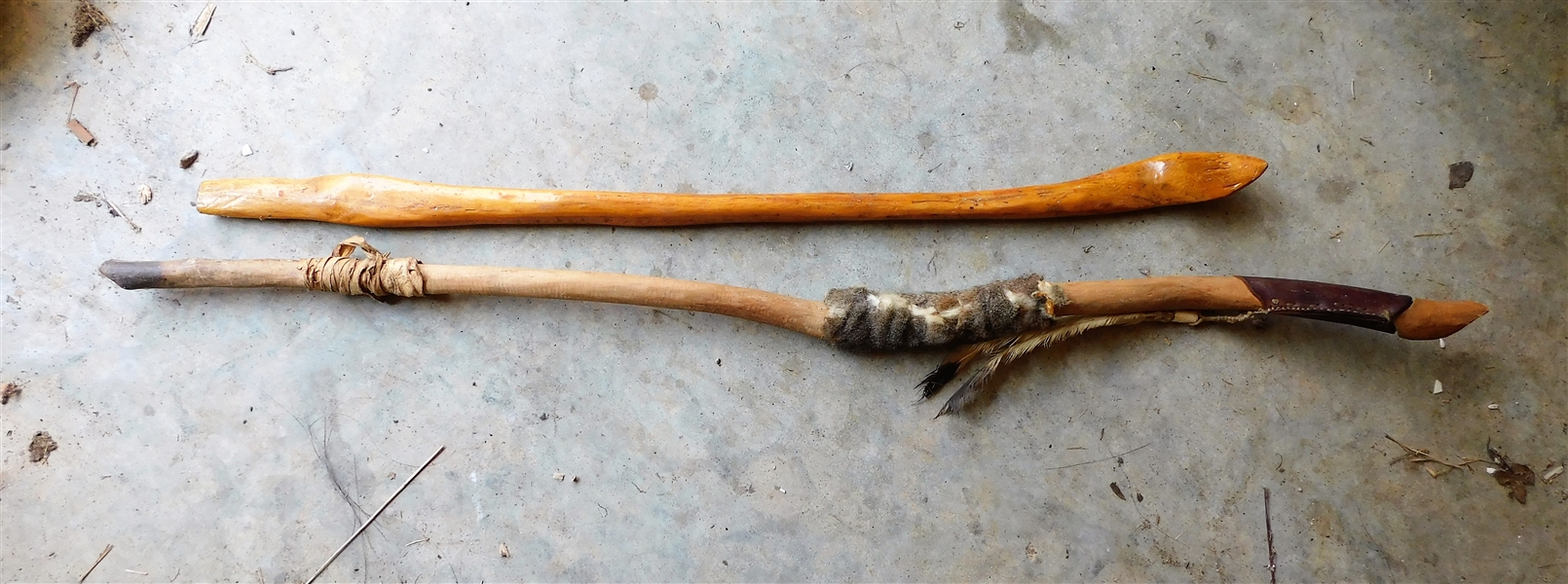 2 Native American Walking Sticks - Taller One Has Fur, Feathers, and Hide