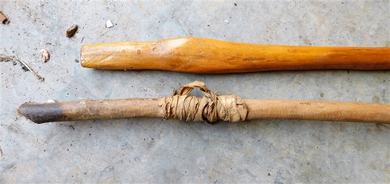 2 Native American Walking Sticks - Taller One Has Fur, Feathers, and Hide