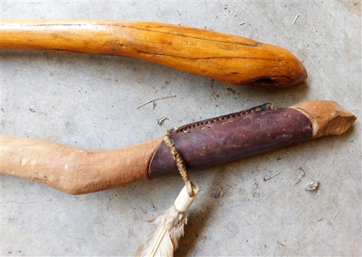 2 Native American Walking Sticks - Taller One Has Fur, Feathers, and Hide