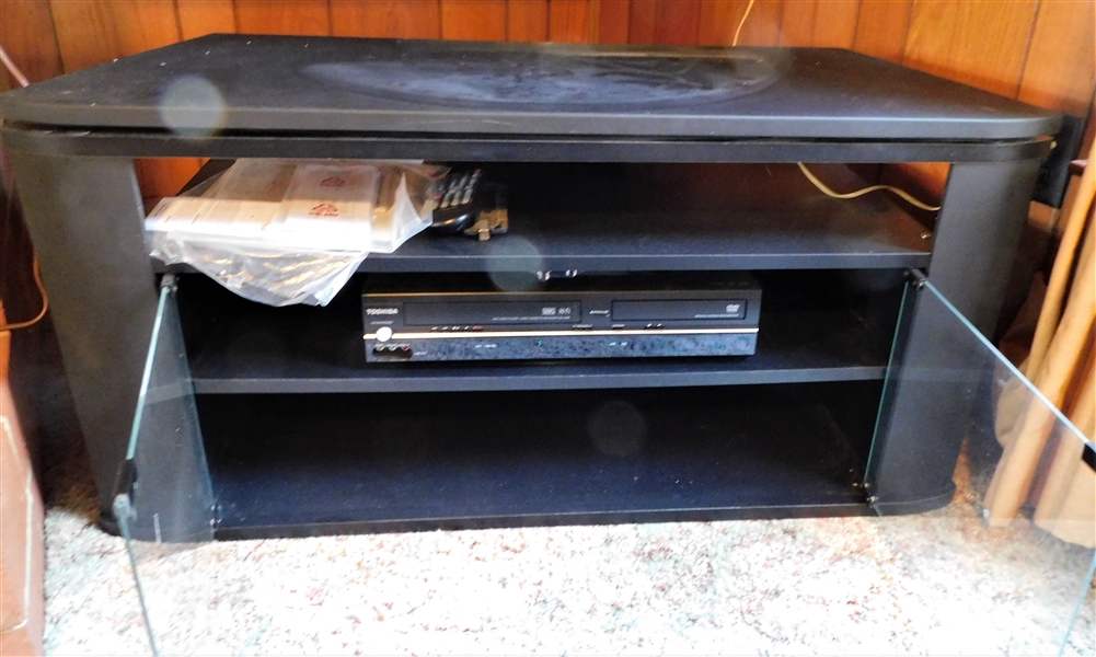 Black Swivel Top TV Stand with Glass Doors  with Toshiba DVD / VCR Player - 19" tall 37" by 18" 