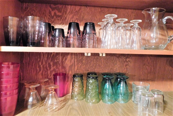 2 Shelves of Glassware including Pink, Purple, Green, and Clear 