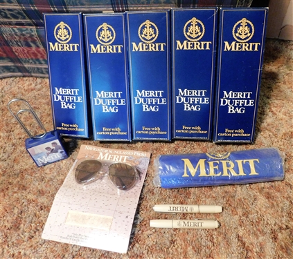Lot of Merit Tobacco Promo Items including Tote Bags, Desk Clip, Pocket Pen Light, and Sunglasses