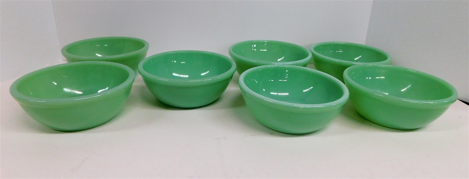 7 Fire King Jadeite Cereal Bowls - 5 1/2" Across - 4 Signed Fire King Oven Ware, 1 Fire King Oven Glass, 2 Fire King Made in USA