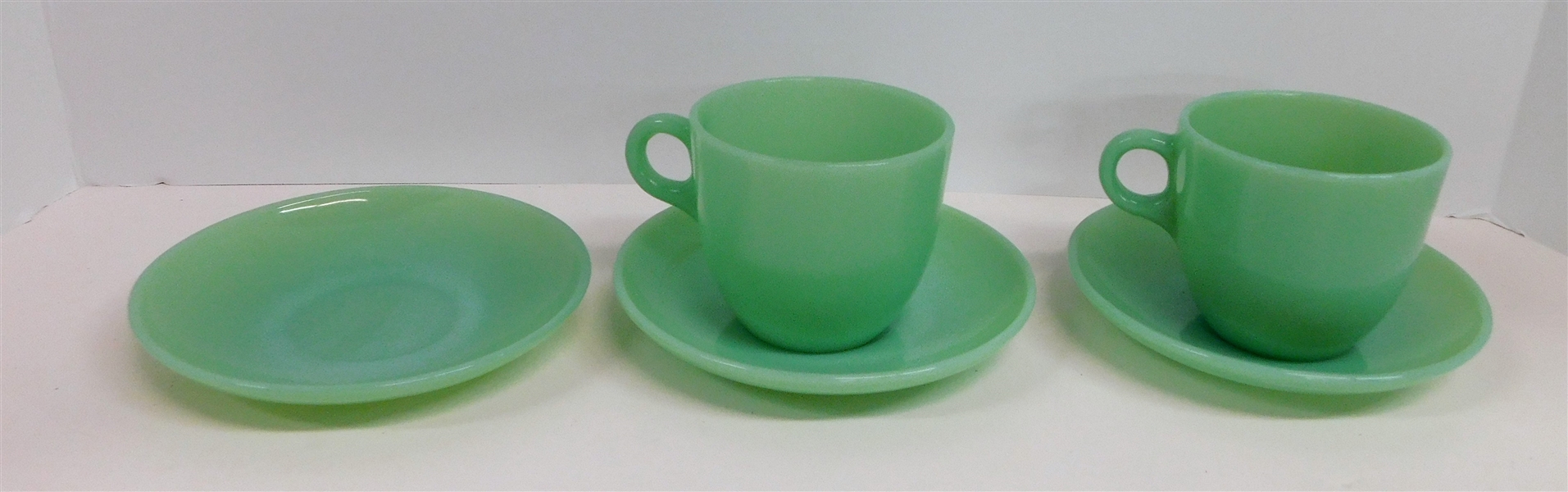 2 Jadeite Fire King C Handle Cups and 3 Fire King Saucers