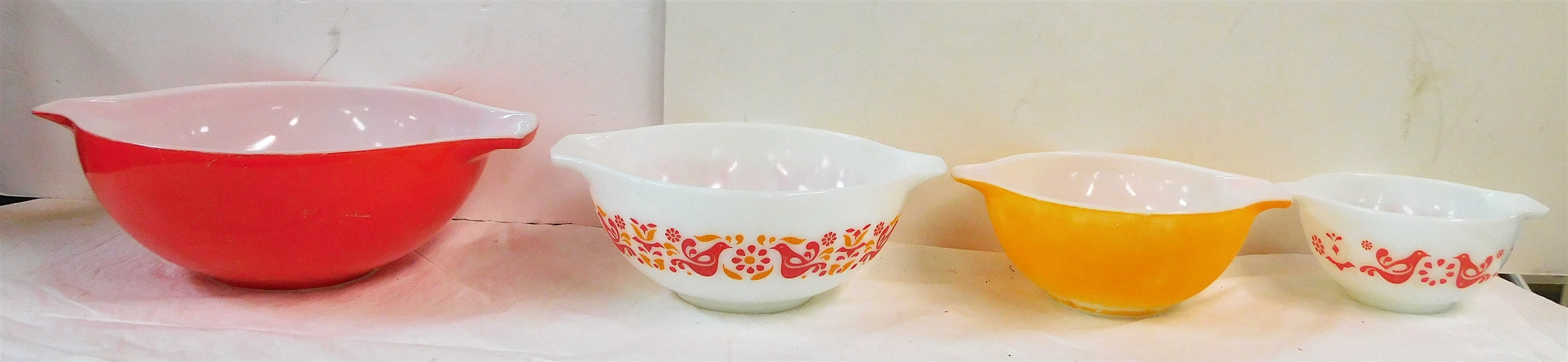 Nesting Set of 4 Pyrex Mixing Bowls - Smallest with Birds  6", Largest Red 10 1/2" Color is Fading - Chip on Rim of Red and Yellow Bird Bowl 