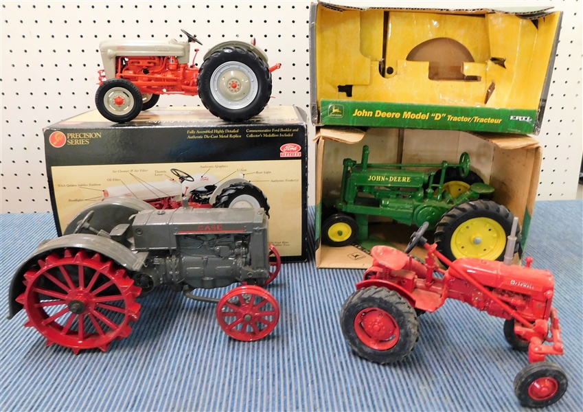 4 Die Cast Tractors including - 1934 John Deere Model A, Case, Farmall, and Oliver Plus Empty John Deere Box