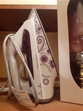Rowenta Iron, Candle Lamp, and Rocket Nut Cracker