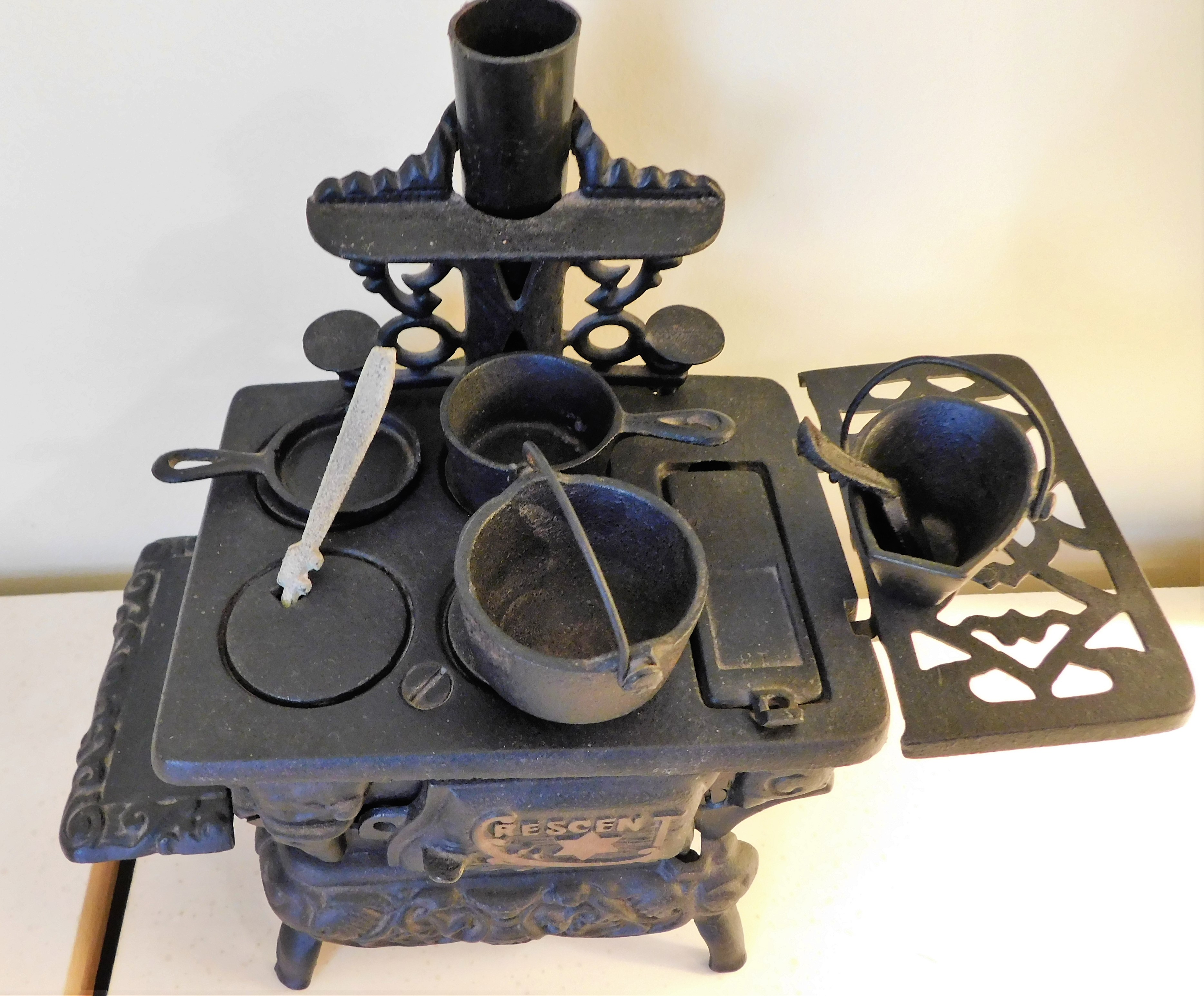 Sold at Auction: Crescent Miniature cast iron Fuel Stove with Pots