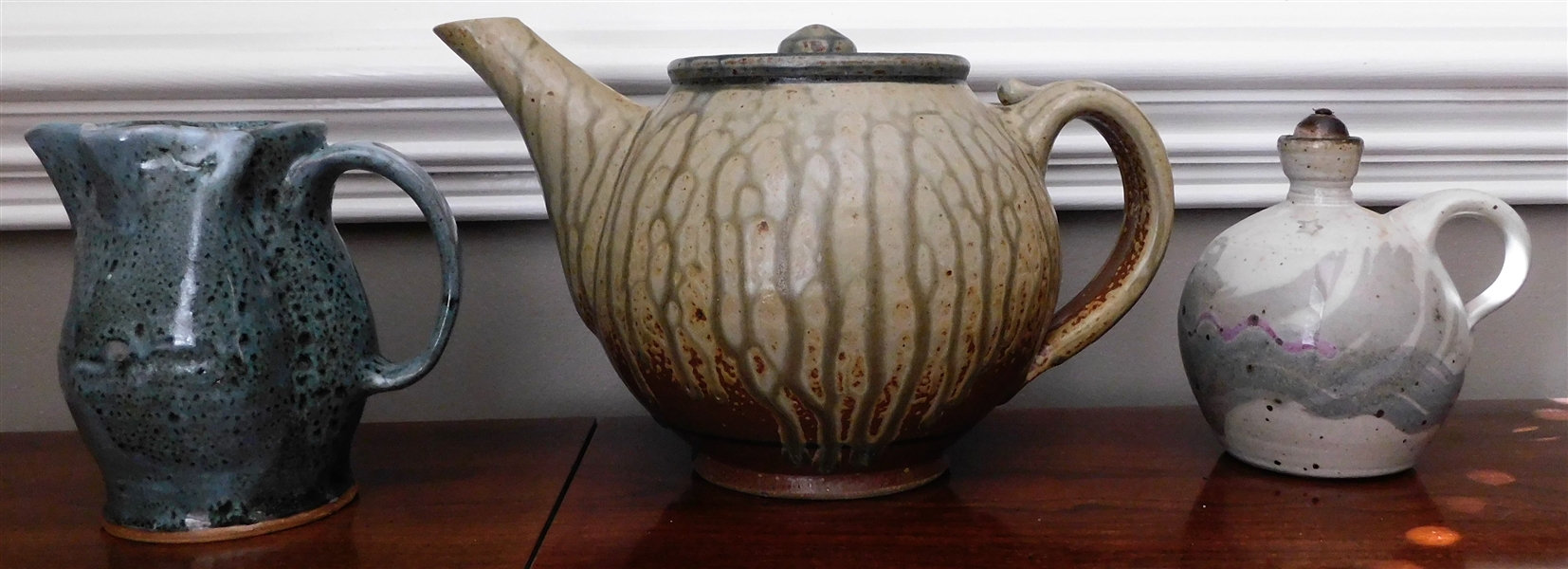 3 Pieces of Art Pottery including Tea Pot 6" tall 10" Spout To Handle, MB Pitcher, and Oil Lamp