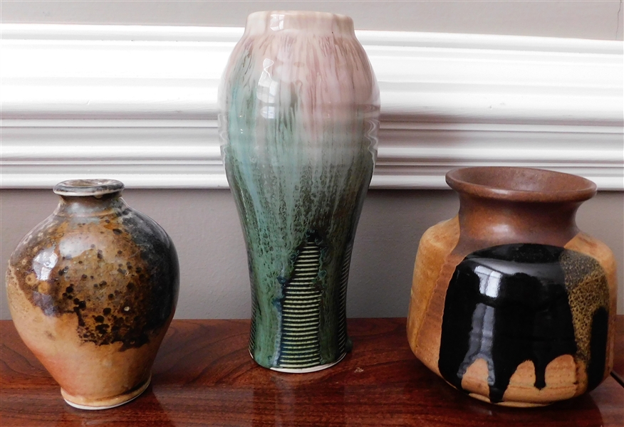 3 Art Pottery Vases including Green and Light Purple 8" Vase, 4" Vase with K Stamp, and Other Brown and Black Vase