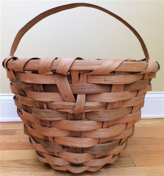 Well Made Basket Measures 12 1/4" tall  by 18" Across not including Handle 