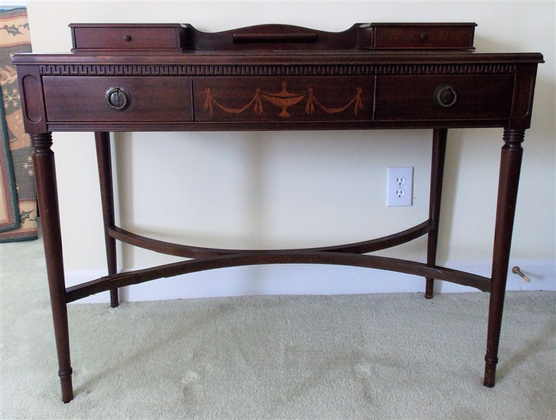 Mahogany Writing Desk with Inlaid Urn Decoration - Divided Center Drawer - Measures - 32 1/2" tall 40" by 20" - Base Needs Some Veneer Repair - See Photo