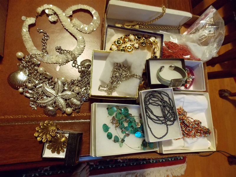 Lot of Costume Jewelry including Costume Jewelry,  Mother of Pearl Necklace, Bracelet, and Earring Set, Starfish Necklace and Earrings,  Beaded Necklaces, Etc. 