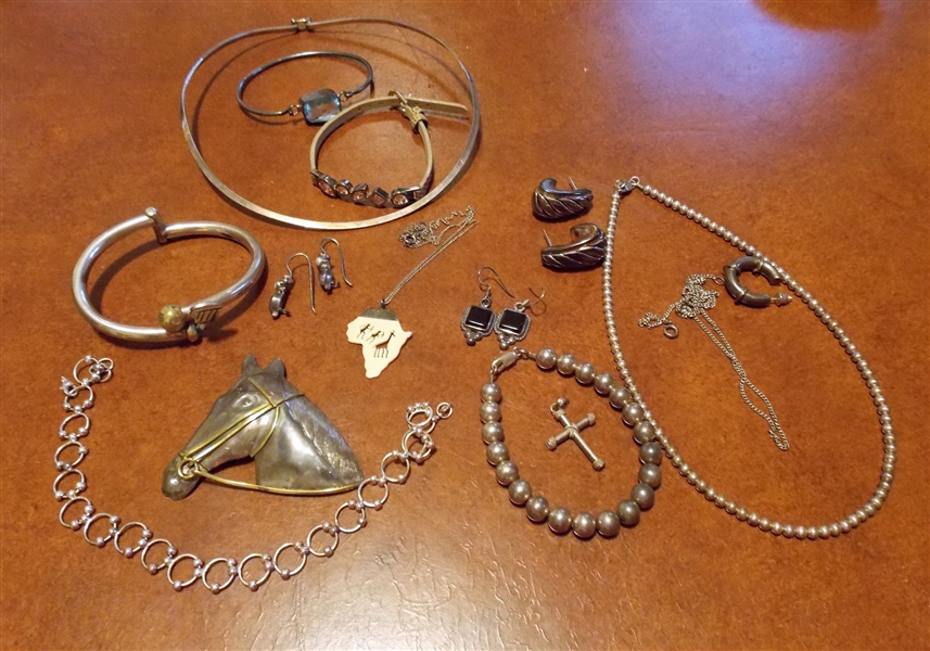 Lot of Sterling Silver Jewelry including Mexico Horse Pin, Golf Bracelet, Bracelet with Faceted Blue Stone, Earrings, and Necklaces 