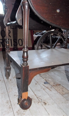 Rolling Wood Tea Cart with Glass tray Top - Front Leg Needs Repair and Needs Dusting - Finish is Ok - Measures 27 tall 28 1/2 by 17 1/2