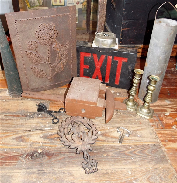 Exit Sign, Tin Horn, Punched Tin, Brass Candle Sticks, Mouth Harp?, Candle Snuff, Trivet, and Wood Piece