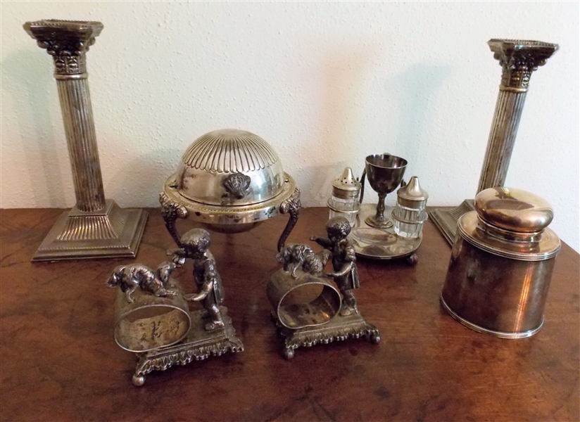 Lot of Silverplate including Candle Stick, Revolving Lid Butter Dish, Pair of Column Candlesticks, Figural Napkin Rings ( Missing Feet), Etc. 