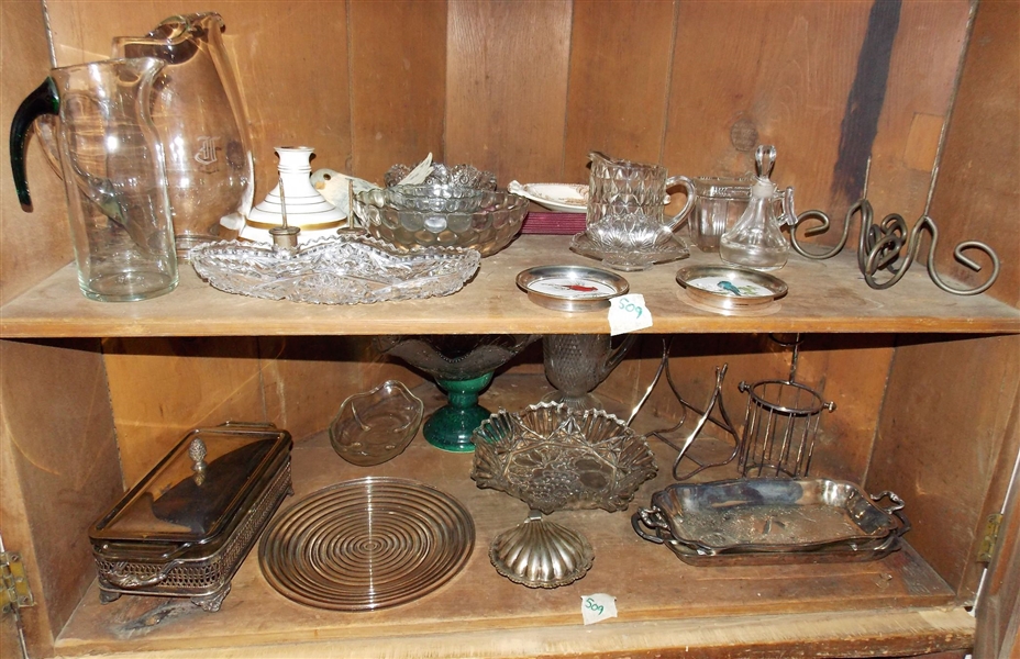 Contents of Bottom of Corner Cupboard - 2 Shelves Full including Cut Glass, Press Glass, Pitchers, Silverplate, Candle Holders, Bowls, Cruets, Etc. 
