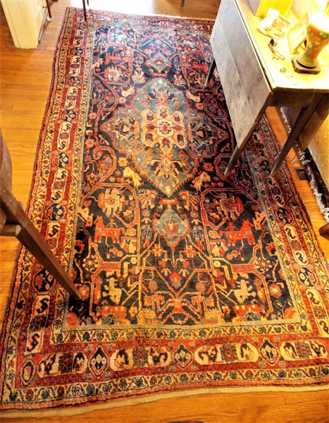 Red, Blue, and Cream Hand Made Oriental Rug - Measures 106" by 55"